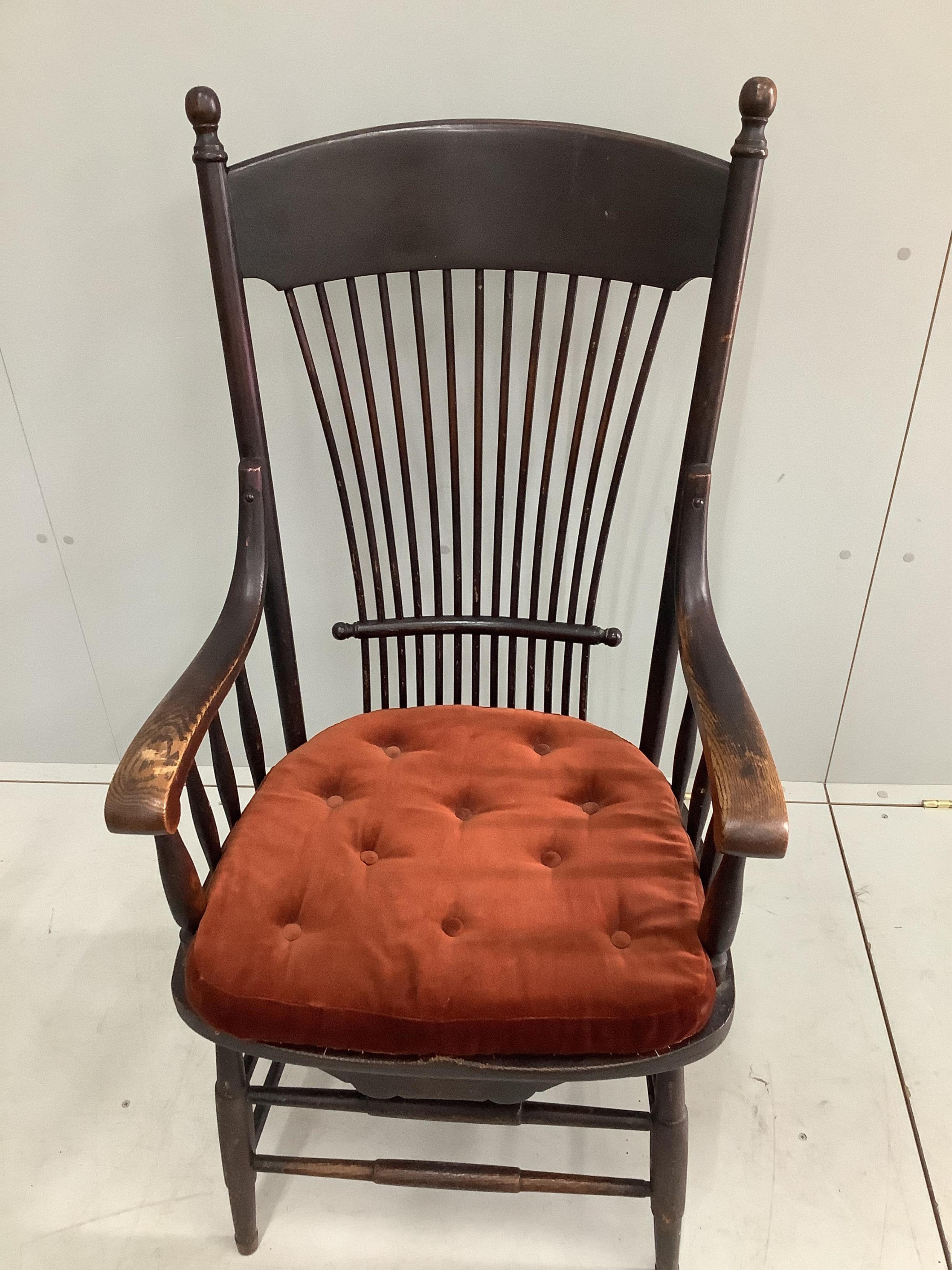 An early 20th century American ash armchair, width 60cm, depth 46cm, height 114cm. Condition - fair